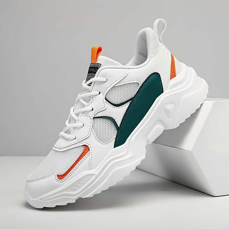 Men's chunky breathable sneakers in white and teal with orange accents and mesh upper, perfect for casual wear.