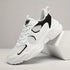 Men's chunky breathable sneakers in white and black, featuring lace closure and mesh design, ideal for casual wear.