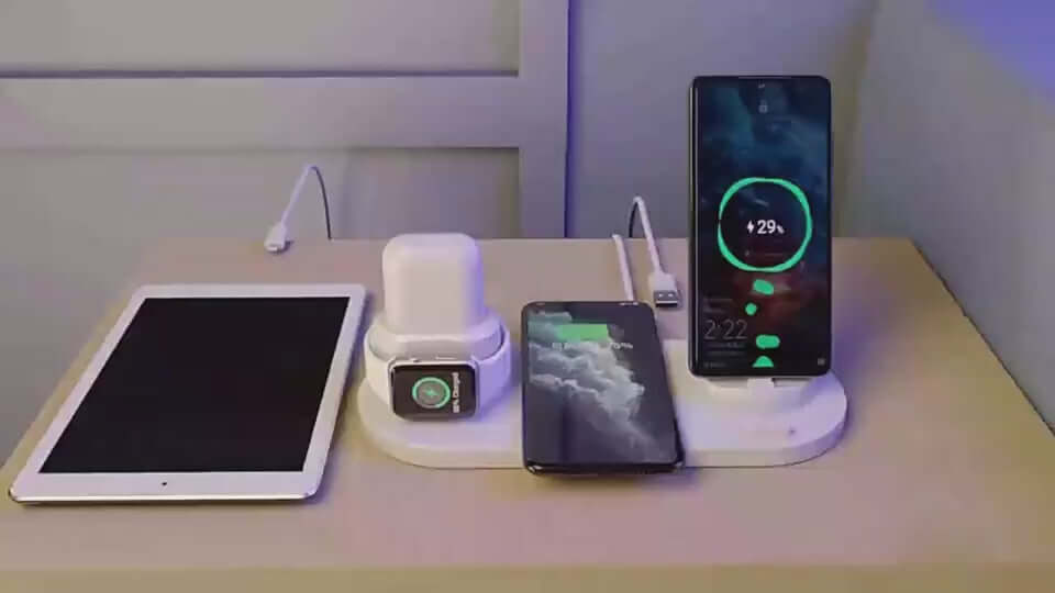 Wireless charger station showcasing iPhone, Apple Watch, and tablet, efficient fast charging on display.