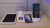 Wireless charger station showcasing iPhone, Apple Watch, and tablet, efficient fast charging on display.